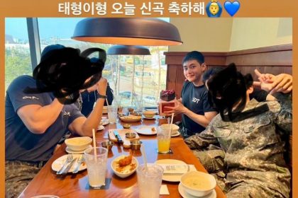 V receives a congratulatory cake from his fellow soldiers in honor of ‘FRI(END)S’ release
