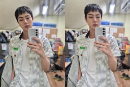 Jin shows off his school uniform look as he visits his alma mater