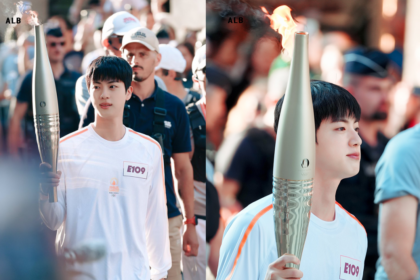 Jin triumphantly carries the Olympic flame in Paris as first torchbearer at the Louvre