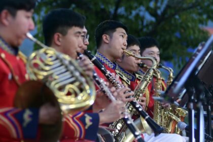 Saxophonist RM spotted performing with the 15th Infantry Division at the ‘Hwacheon Tomato Festival’