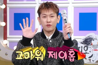 Crush shows off the custom microphone gift he received from J-Hope